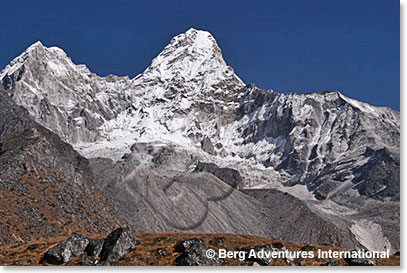 Ama Dablam - The meaning of this spectacular mountain is “Mother’s Jewel or Necklace” the ridges flowing out from each side of her like the arms of a mother (Ama) protecting her child. The (Dablam) is the obvious hanging serac you can see near the top. A Dablam is a traditional pendant worn by Sherpa women containing pictures of the gods.