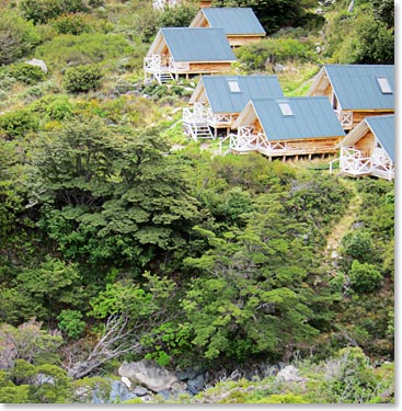 Our cozy cabins nestled into the grassy hillside