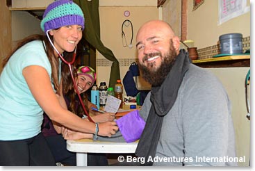 Jason gets his blood pressure checked at the clinic today by Veronica. The entire team checked out and are cleared to continue acclimatizing