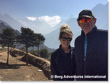 Kylie and Garv.  That is Everest on the left with the big plume. Lhotse in the middle and the finger on the right is Ama Dablam