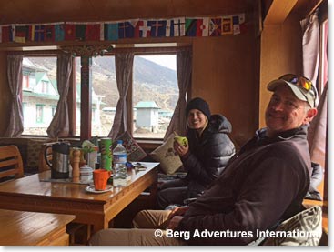 Relaxing with coffee, tea and Pringles in the dining room at Himalayan Lodge, Pheriche