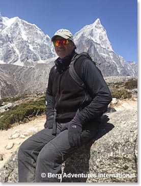 Taking a rest along the trail.  That is Ama Dablam jutting into the sky to Garv's right in the photo. 