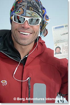 Devin carried the cancelled passport of the man who inspired him to come on this trip, Rob Dunn, to the top