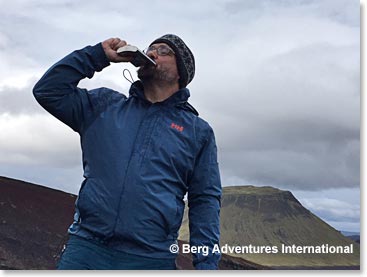 Andy celebrating being in Iceland with a sip of Scotch