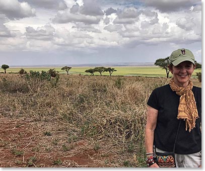 Donna with the lovely expanse of wild Tarangire behind her