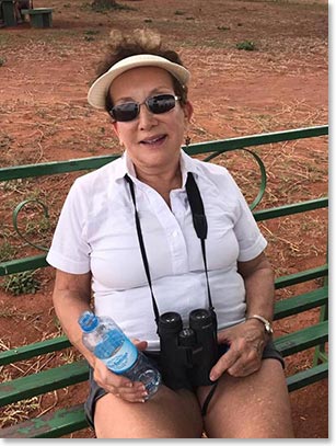 Marjorie with two safari essentials: plenty of water and good binoculars