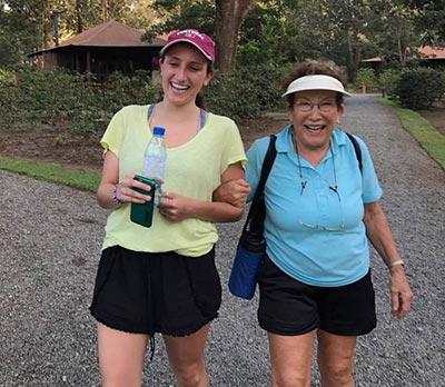 Jessica and Marjorie walking the familiar grounds at Arusha Coffee Lodge.