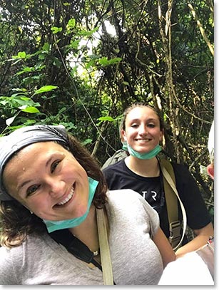 Allie and Jessica smiling in the forest