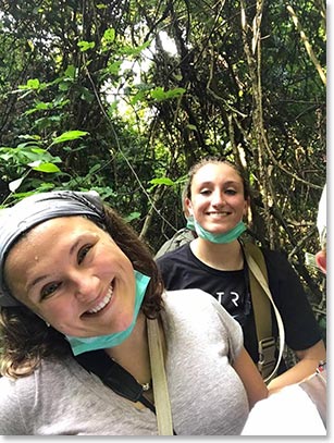 Allie and Jessica smiling in the forest 