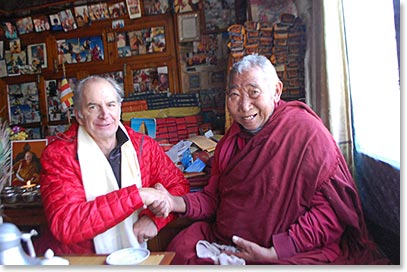 Mark sharing a handshake and smiles with Lama Geshi