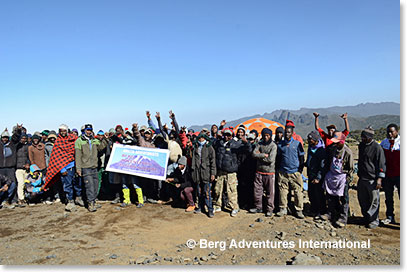 The team are welcomed by the porters upon arrival