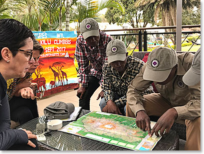 Erick going over maps of our route, 'The Lemosho'