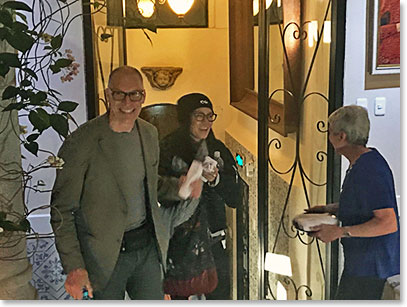Gordon and Tina being welcomed by Colette