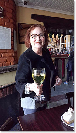 Linda enjoying a glass of wine at La Leona