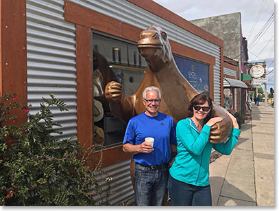 Cliff and Bev with giant sloth in Puerto Natales