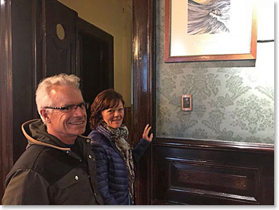 Cliff and Bev viewing drawings at the Shackleton Bar in Punta Arenas