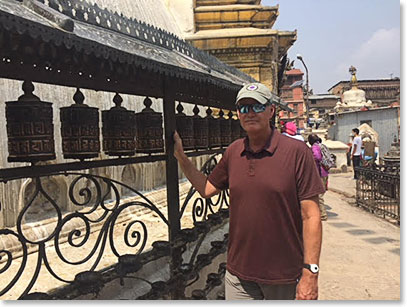 Jack spinning the first of may Buddhist prayer wheels that the team will pass on this trip.