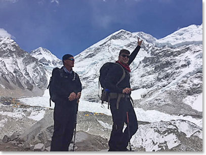 Scott pointing at the very summit of Everest