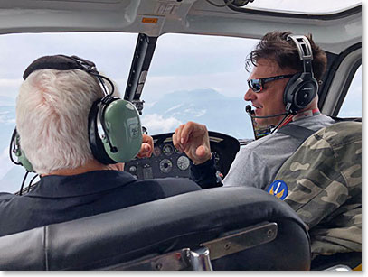 Frank Giustra and Helicopter pilot