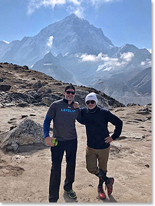 Scott Walker and Frank Giustra with the mountain Nuptse behind in our way to Base Camp