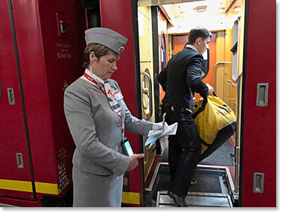 Our duffels bags are carried to the train storage room