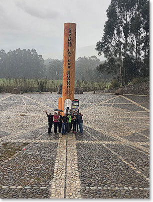 The team straddles the Equator just outside of Otavalo