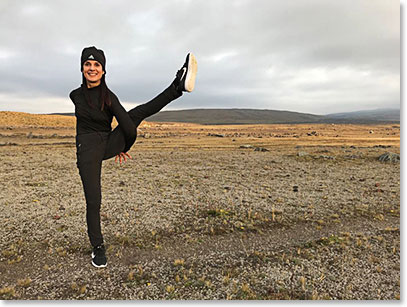 Christina doing some yoga and stretching before the climb