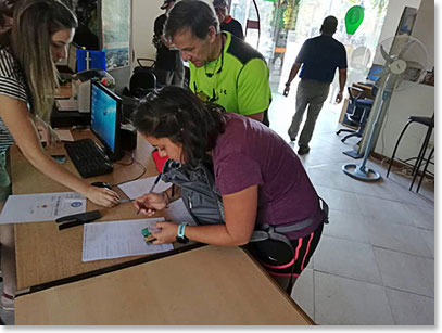 Kara signing her permit form at the Mendoza Provincial Park office on the way out of town