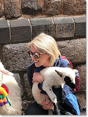 Christine with a baby Lama on the Plaza at Cusco today