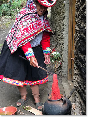 Local lady demonstrating how to die alpaca before weaving