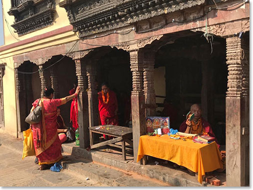 It’s a Buddhist Temple. Here a Hindu women make offerings to God Shiva.