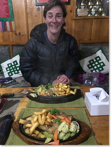 Adriana at Paradise Lodge in Lukla – enjoying a house specialty 