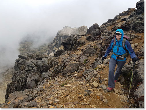 Melody climbing on the beautiful, lonely trails leading to the top of Ruca Pichincha