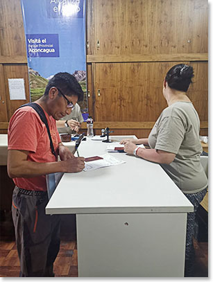 At the Park Headquarters to get our permits,  Sergio is completing his form.