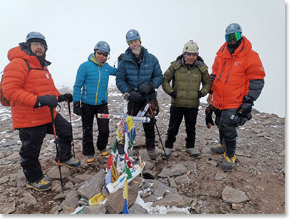 Joe, Alex, Shannon, Sergio and Patrick at the iconic summit cross at the summit of Aconcagua.